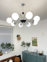 modern-mid-century-glass-globe-chandelier-with-metal-rod-frame-and-white-opal-shades