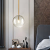 Modern Minimalist Clear Glass Globe Pendant Light with Iron Hardware for Dining Room