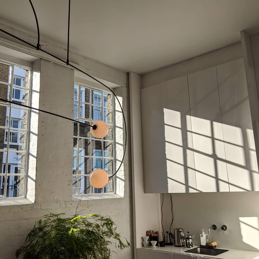 Modern Minimalist Linear Mobile Chandelier with Opal Glass Globes and Black Finish