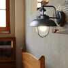 Modern Nautical Black Outdoor Wall Sconce with Seeded Glass and Metal Cage for Porch