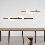 Modern Scandinavian Wood Linear Pendant Light with Glass Globe Shades