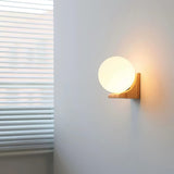 Modern Spherical Glass Globe Wall Sconce with Natural Solid Wood Base and G9 LED Socket