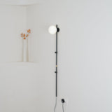 Modern Tall Vertical Stem Wall Lamp with White Glass Globe and Plug In Cord