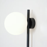 Modern Tall Vertical Stem Wall Lamp with White Glass Globe and Plug In Cord