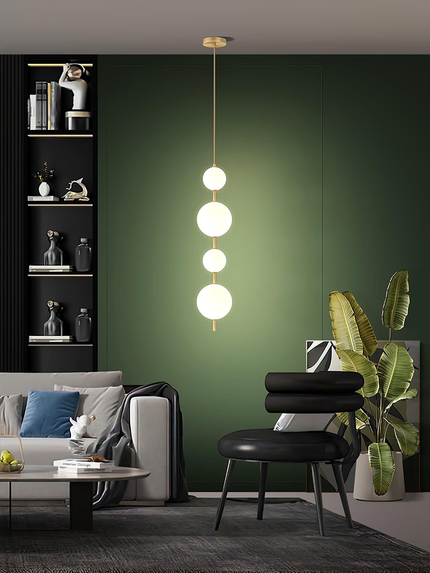 Modern Vertical Glass Globe Pendant Light in Black and Brass Finishes