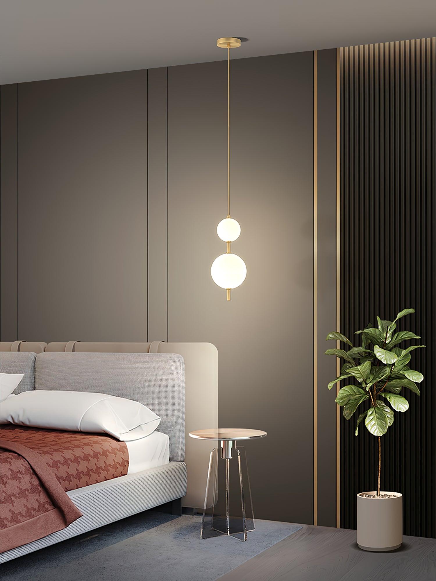 Modern Vertical Glass Globe Pendant Light in Black and Brass Finishes