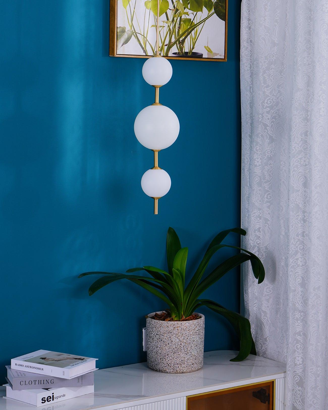 Modern Vertical Glass Globe Pendant Light in Black and Brass Finishes