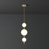 Modern Vertical Glass Globe Pendant Light in Black and Brass Finishes