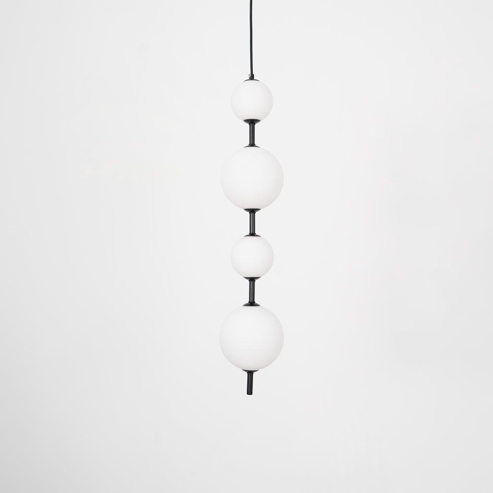 Modern Vertical Glass Globe Pendant Light in Black and Brass Finishes