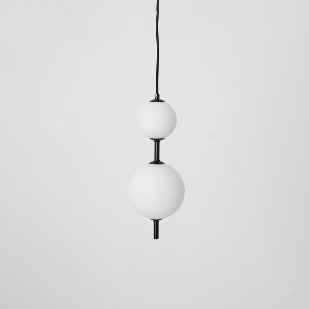 Modern Vertical Glass Globe Pendant Light in Black and Brass Finishes