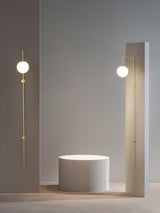 Modern Vertical Gold Wall Sconce with Spherical White Glass Globe Diffuser