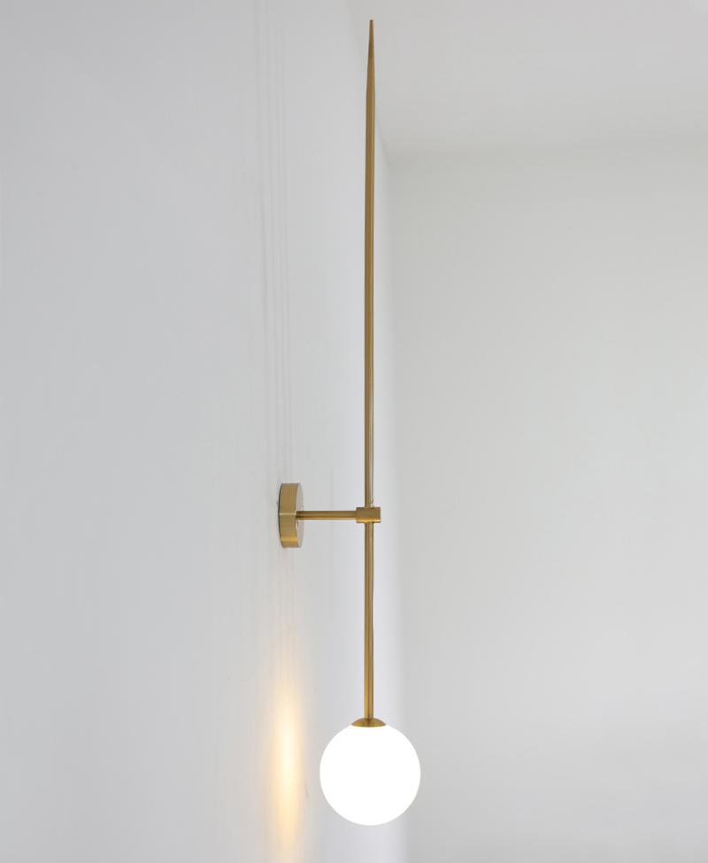 modern-brass-and-opal-glass-sphere-mobile-wall-sconce-lighting-for-indoor-spaces
