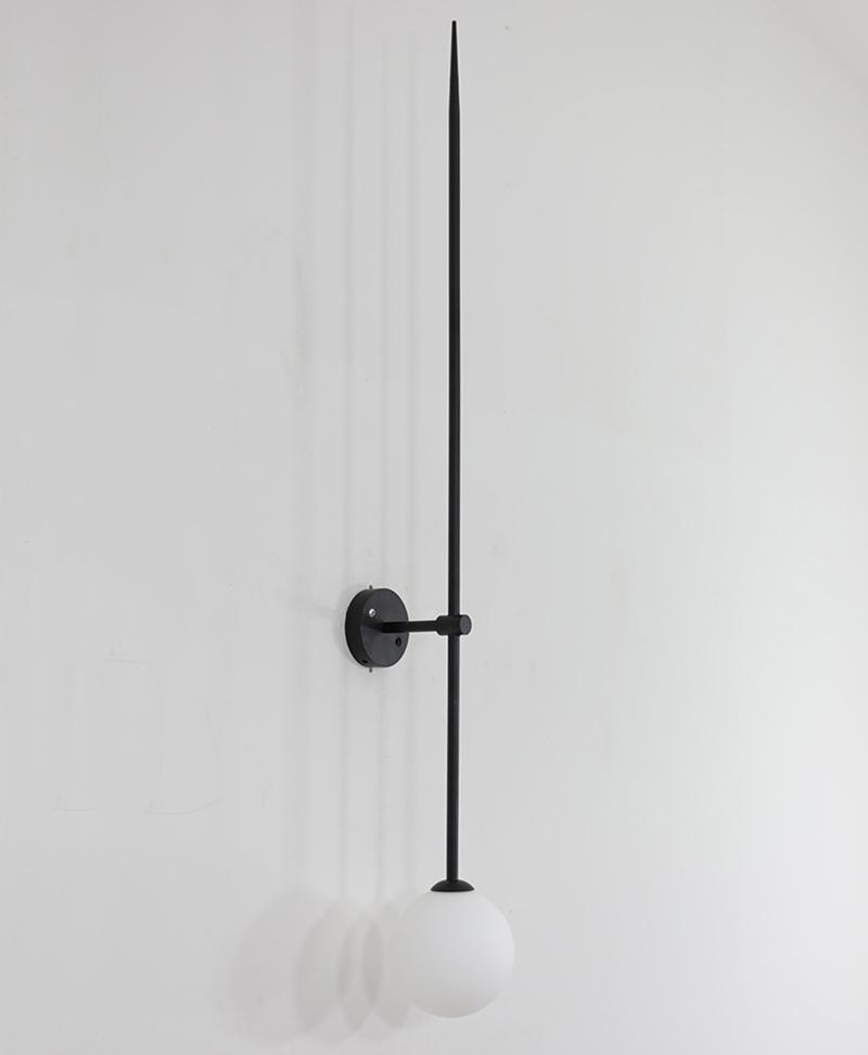 modern-brass-and-opal-glass-sphere-mobile-wall-sconce-lighting-for-indoor-spaces