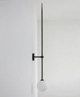 modern-brass-and-opal-glass-sphere-mobile-wall-sconce-lighting-for-indoor-spaces