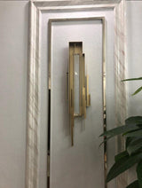 modern-brutalist-gold-metal-sculpted-wall-sconce-integrated-led-vertical-light-fixture