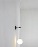 modern-brass-and-opal-glass-sphere-mobile-wall-sconce-lighting-for-indoor-spaces