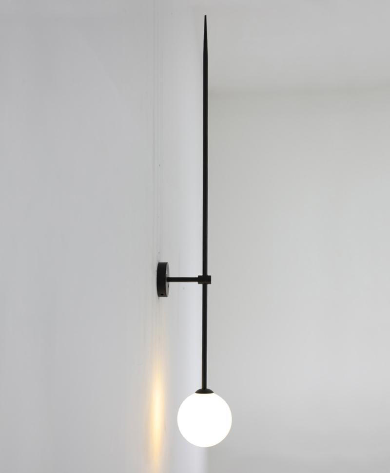 modern-brass-and-opal-glass-sphere-mobile-wall-sconce-lighting-for-indoor-spaces
