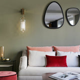 modern-vadim-glass-wall-sconce-with-perforated-metal-cage-and-brass-finish-for-luxury-interiors
