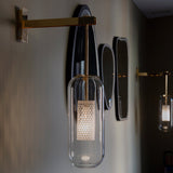 modern-vadim-glass-wall-sconce-with-perforated-metal-cage-and-brass-finish-for-luxury-interiors