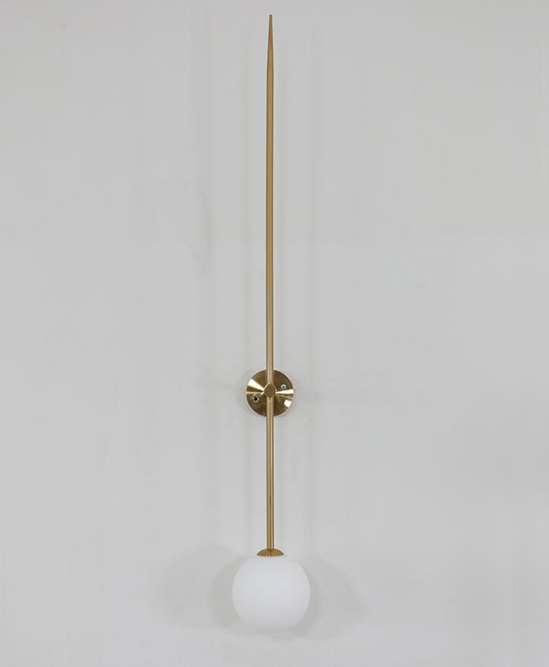 modern-brass-and-opal-glass-sphere-mobile-wall-sconce-lighting-for-indoor-spaces