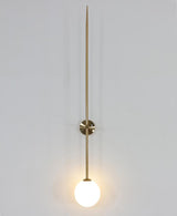 modern-brass-and-opal-glass-sphere-mobile-wall-sconce-lighting-for-indoor-spaces
