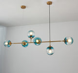 contemporary-multi-glass-globe-pendant-light-with-round-orb-shades-and-polished-brass-frame