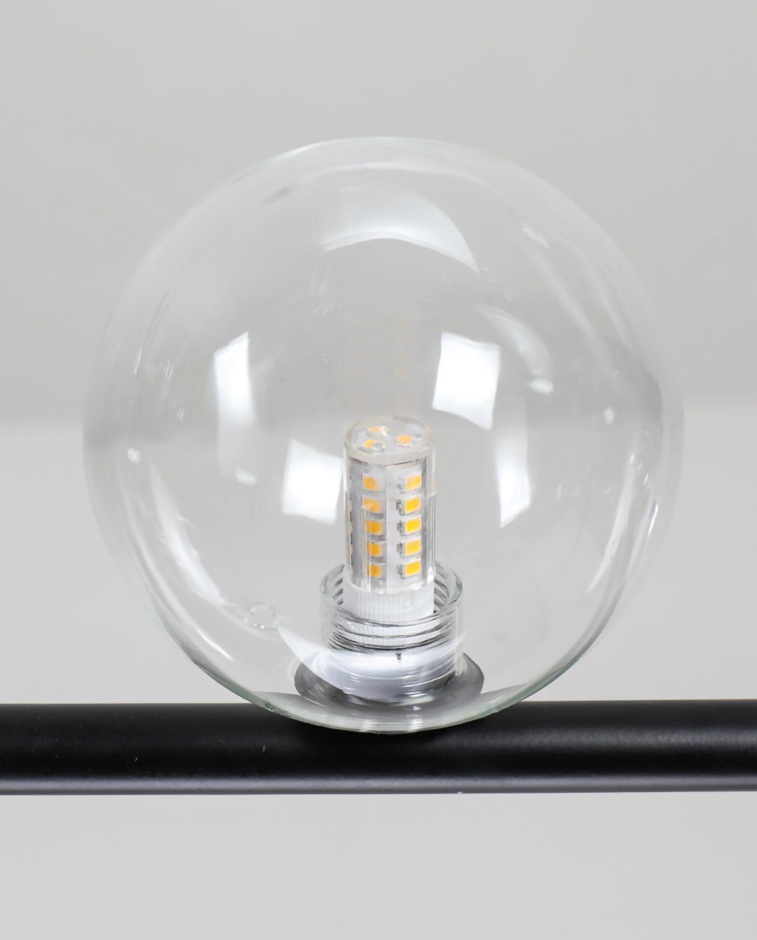 modern-linear-chandelier-with-clear-glass-globe-shades-for-geometric-dining-room-lighting