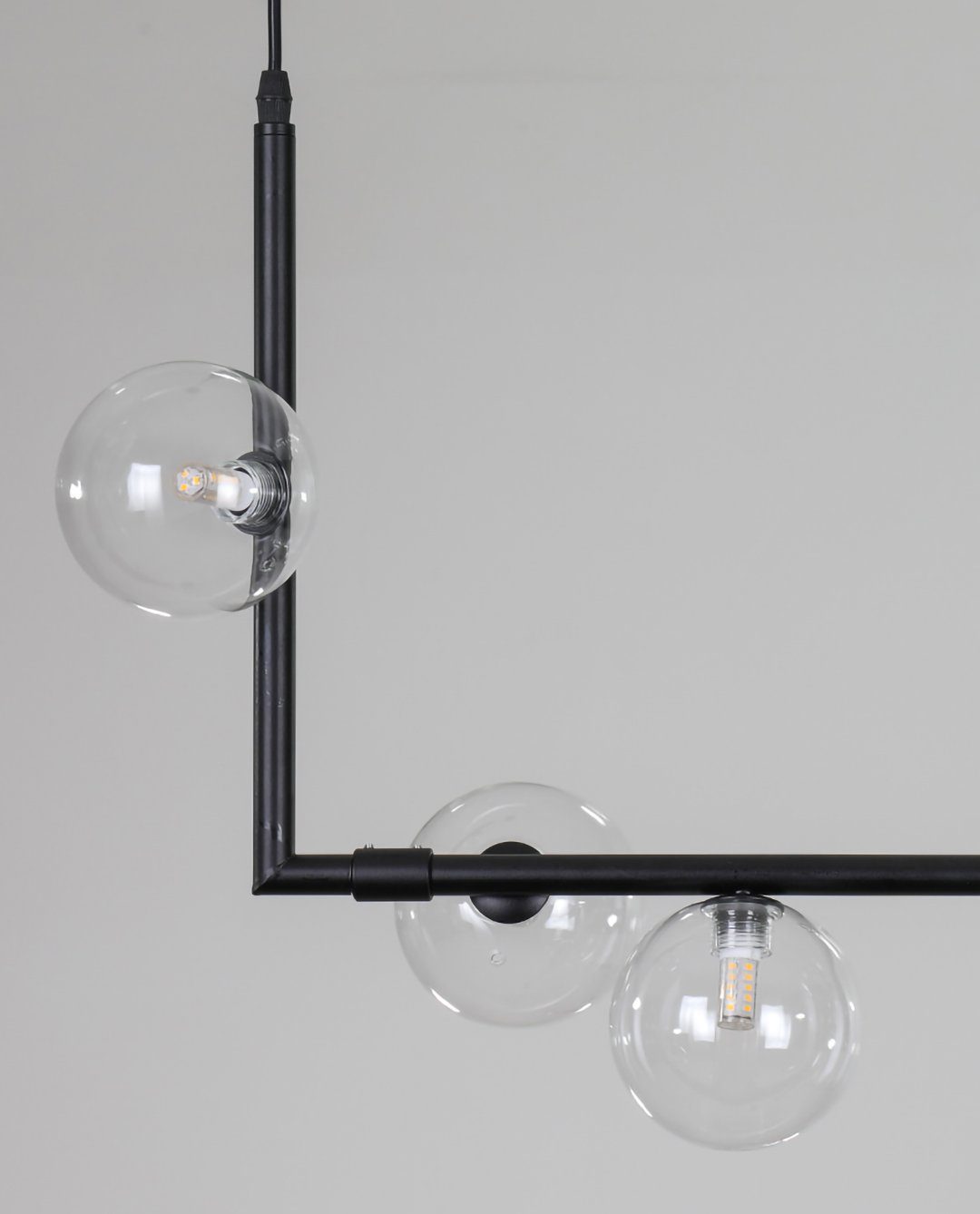 modern-linear-chandelier-with-clear-glass-globe-shades-for-geometric-dining-room-lighting