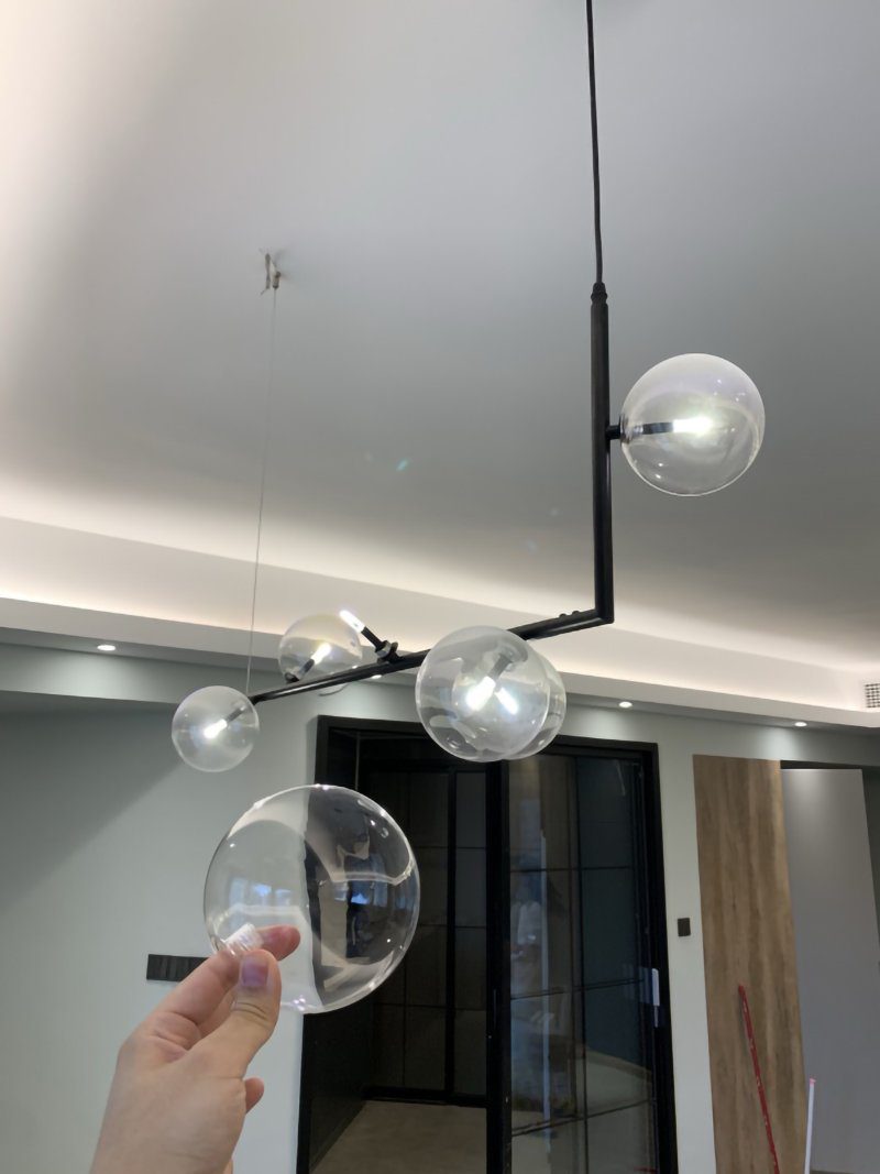 modern-linear-chandelier-with-clear-glass-globe-shades-for-geometric-dining-room-lighting