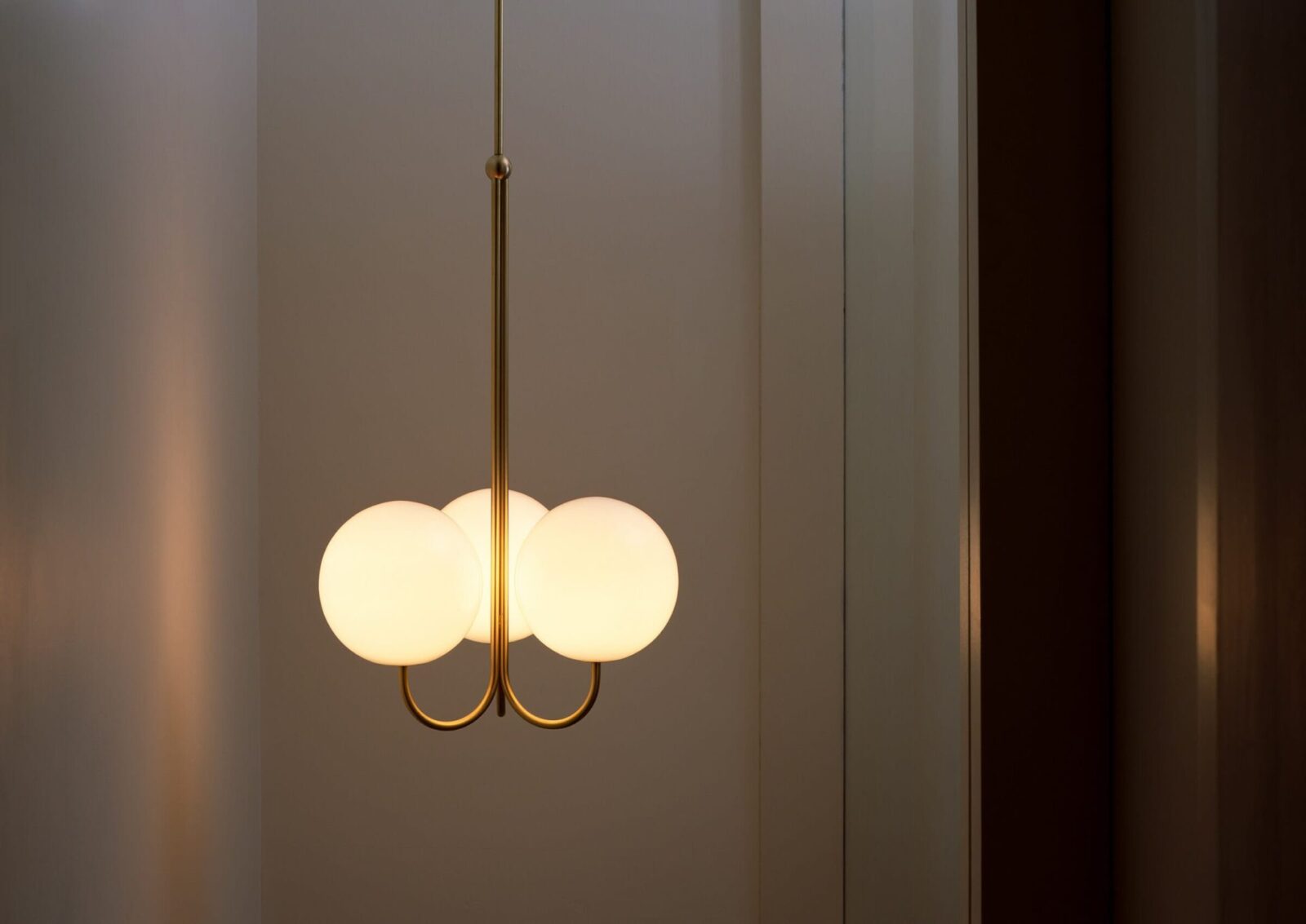 mid-century-modern-triple-angle-brass-pendant-lamp-with-opal-glass-globe-shade