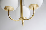 mid-century-modern-triple-angle-brass-pendant-lamp-with-opal-glass-globe-shade