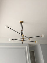 modern-hand-blown-glass-globe-chandelier-with-elegant-brass-and-copper-finishes