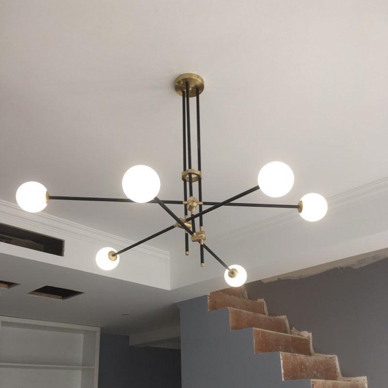 modern-hand-blown-glass-globe-chandelier-with-elegant-brass-and-copper-finishes
