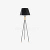 modern-solitaire-tripod-floor-lamp-with-black-polygonal-cloth-shade-and-brass-accents