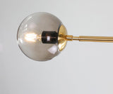 contemporary-multi-glass-globe-pendant-light-with-round-orb-shades-and-polished-brass-frame