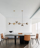 contemporary-multi-glass-globe-pendant-light-with-round-orb-shades-and-polished-brass-frame