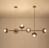contemporary-multi-glass-globe-pendant-light-with-round-orb-shades-and-polished-brass-frame