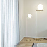 modern-industrial-gold-standing-lamp-with-white-glass-globe-shade-and-foot-switch