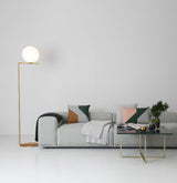 modern-industrial-gold-standing-lamp-with-white-glass-globe-shade-and-foot-switch