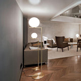 modern-industrial-gold-standing-lamp-with-white-glass-globe-shade-and-foot-switch