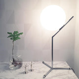 modern-opalescent-blown-glass-globe-table-lamp-with-flexible-steel-base-and-gold-finish