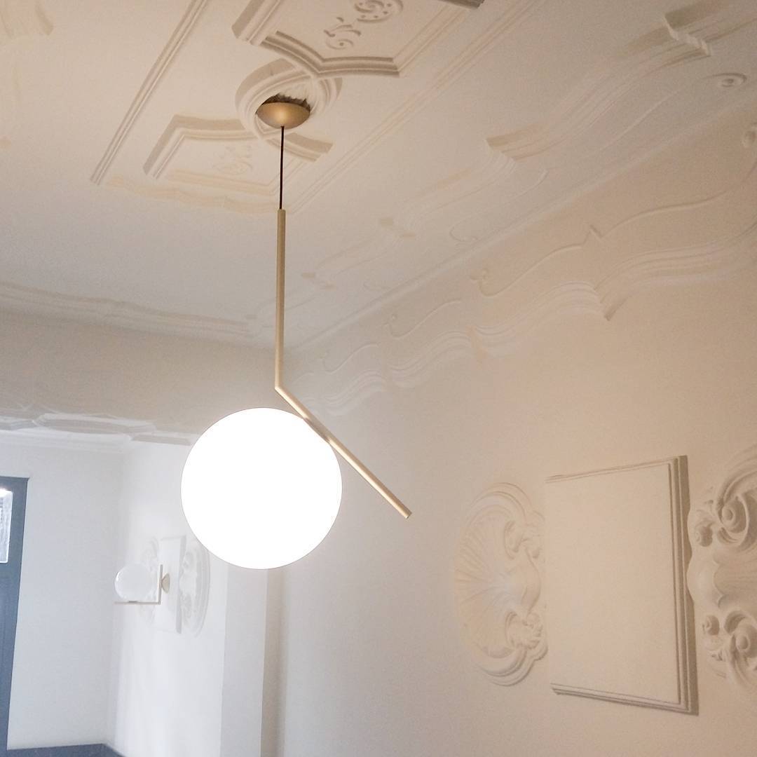 modern-brass-and-opal-glass-globe-pendant-light-minimalist-baton-design-hanging-lamp