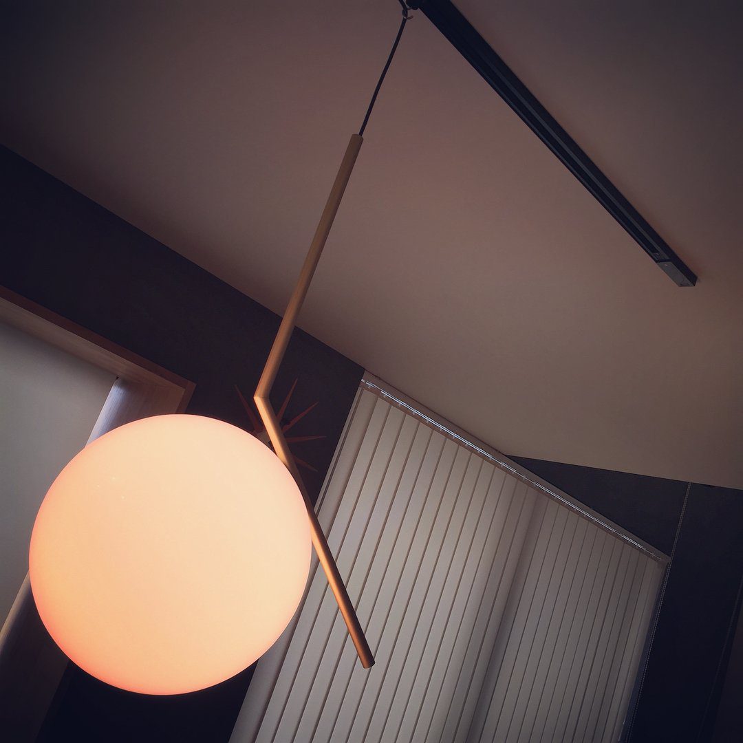 modern-brass-and-opal-glass-globe-pendant-light-minimalist-baton-design-hanging-lamp