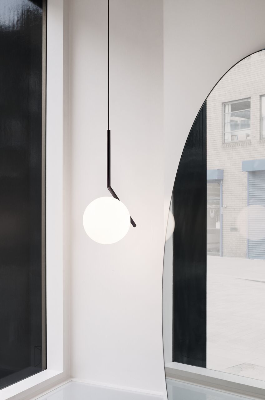 modern-brass-and-opal-glass-globe-pendant-light-minimalist-baton-design-hanging-lamp