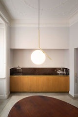 modern-brass-and-opal-glass-globe-pendant-light-minimalist-baton-design-hanging-lamp