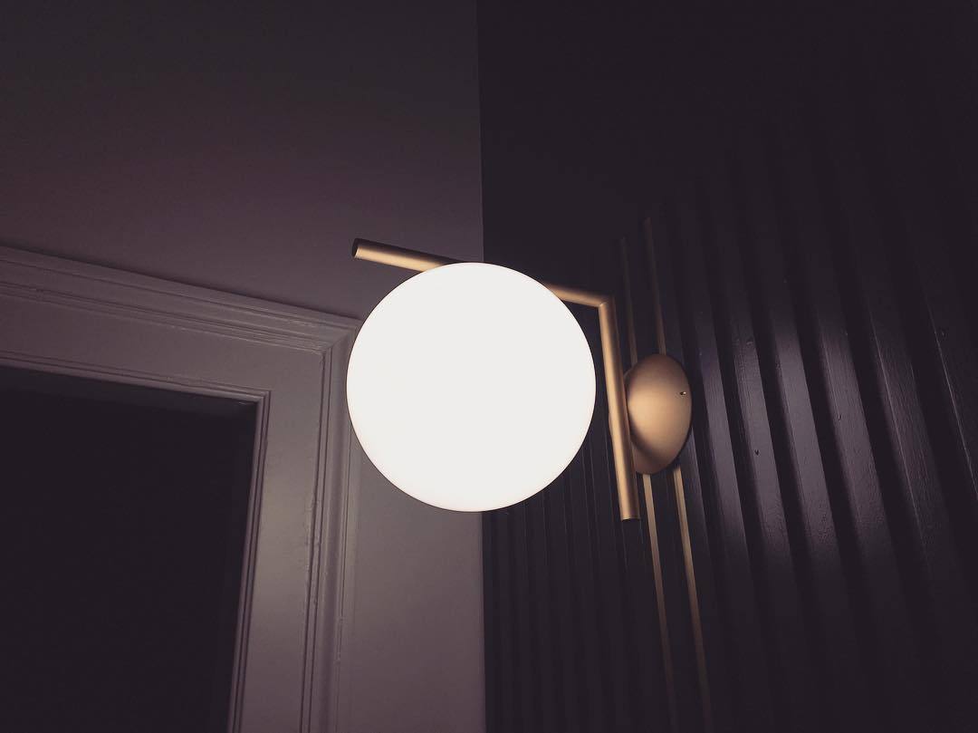 modern-opal-blown-glass-wall-sconce-with-elegant-brass-finish-round-globe-lighting