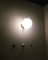 modern-opal-blown-glass-wall-sconce-with-elegant-brass-finish-round-globe-lighting