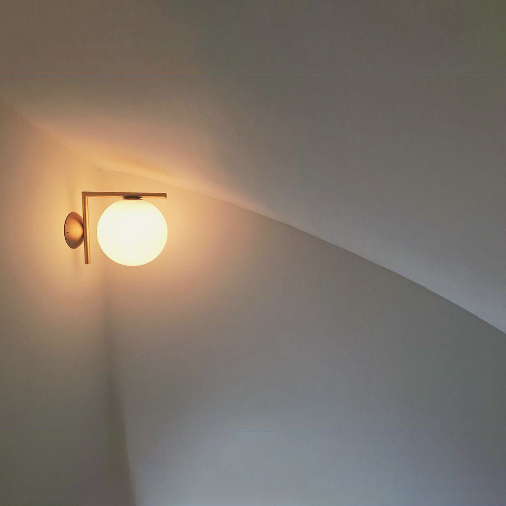 modern-opal-blown-glass-wall-sconce-with-elegant-brass-finish-round-globe-lighting