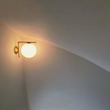 modern-opal-blown-glass-wall-sconce-with-elegant-brass-finish-round-globe-lighting