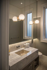modern-opal-blown-glass-wall-sconce-with-elegant-brass-finish-round-globe-lighting